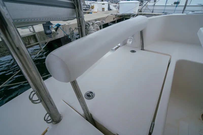 Slide: The Image of Leopard 38 yacht cockpit detail, 2011 model, featuring white seating and stainless steel railing. - 60