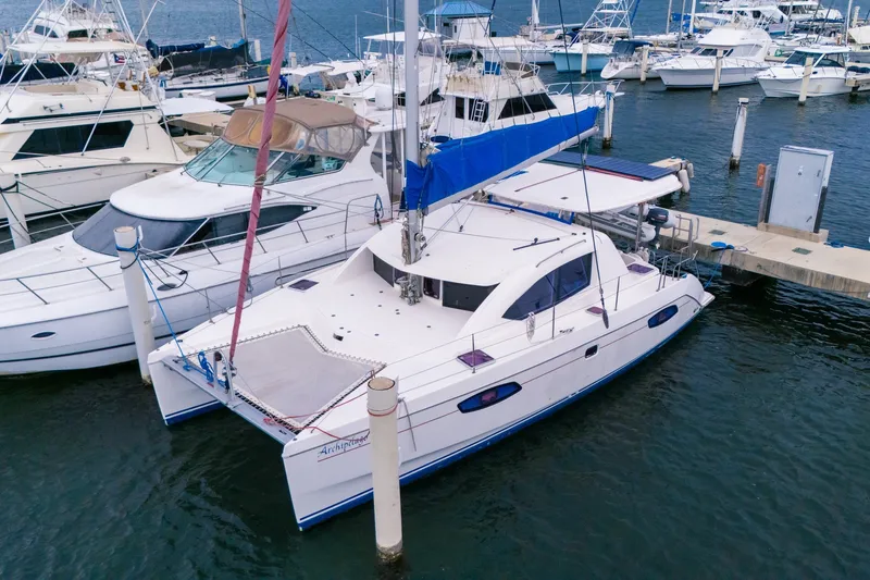 The Image of Catamaran Leopard 38, 2011 model, docked at marina with other boats. - 1