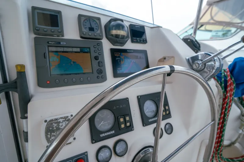 Slide: The Image of Steering console of a 2011 Leopard 38 yacht with navigation instruments and controls. - 22