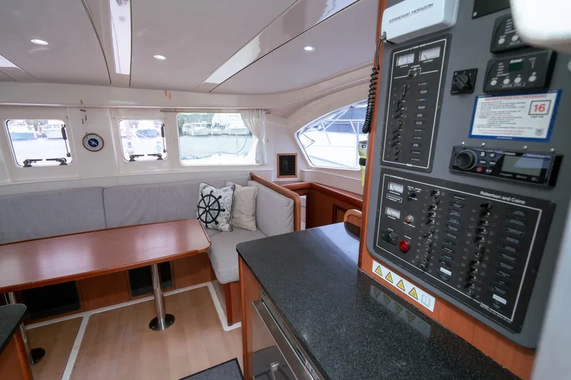 Slide: The Image of Interior of 2011 Leopard 38 yacht with seating area and control panel. - 105