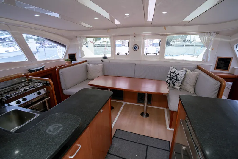 Slide: The Image of Spacious interior of 2011 Leopard 38 catamaran with modern kitchen and cozy seating area. - 104