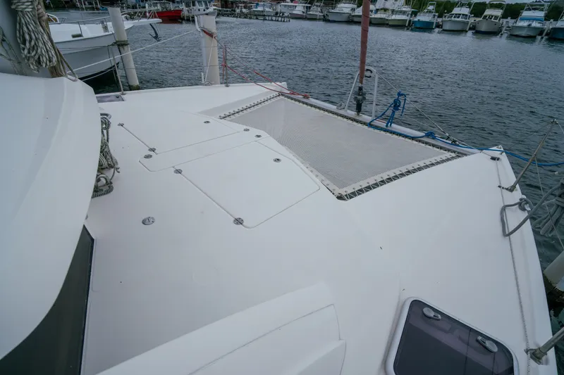 Slide: The Image of Leopard 38 catamaran deck, 2011 model, docked in a marina with surrounding boats. - 39