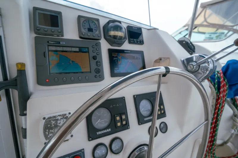 Slide: The Image of Helm of 2011 Leopard 38 yacht with navigation instruments and steering wheel. - 21