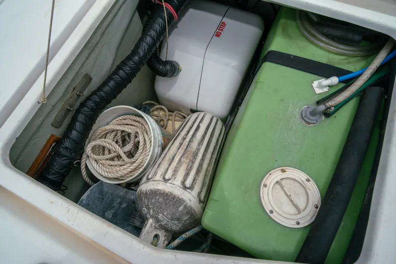 Slide: The Image of Storage compartment of a 2011 Leopard 38 boat with ropes and equipment. - 153