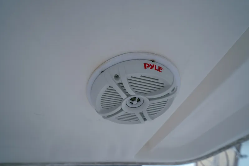 Slide: The Image of Ceiling-mounted Pyle speaker on a 2011 Leopard 38 yacht interior. - 64