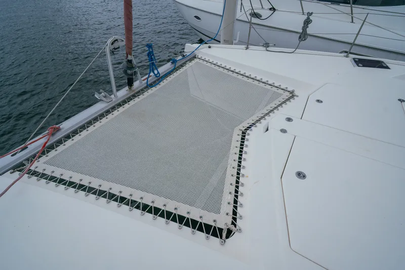 Slide: The Image of Catamaran deck with netting, Leopard 38 model, 2011, on calm water. - 37
