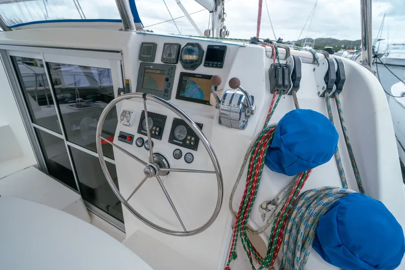 Slide: The Image of Steering wheel and controls of a 2011 Leopard 38 catamaran yacht. - 20