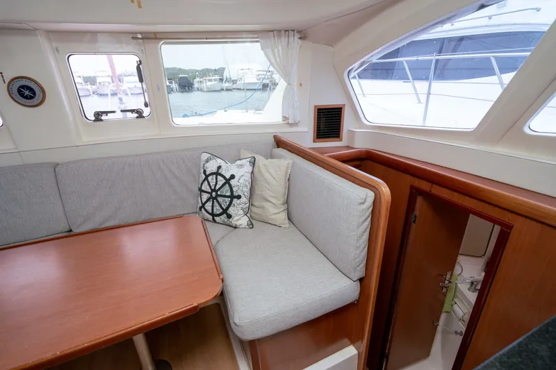 Slide: The Image of Interior of 2011 Leopard 38 yacht with cozy seating and nautical decor. - 137