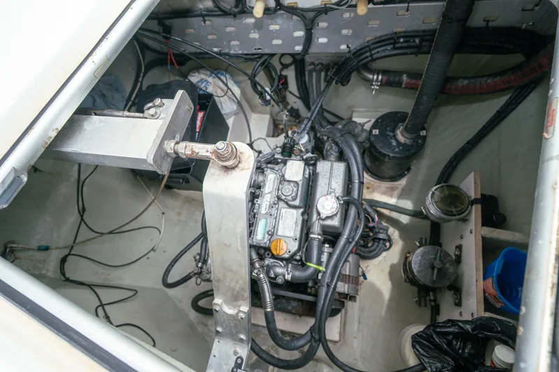 Slide: The Image of Engine compartment of a 2011 Leopard 38 catamaran, showcasing mechanical components and wiring. - 145