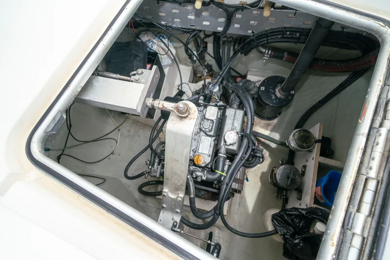 Slide: The Image of Engine compartment of a 2011 Leopard 38 catamaran, showcasing mechanical components and wiring. - 146