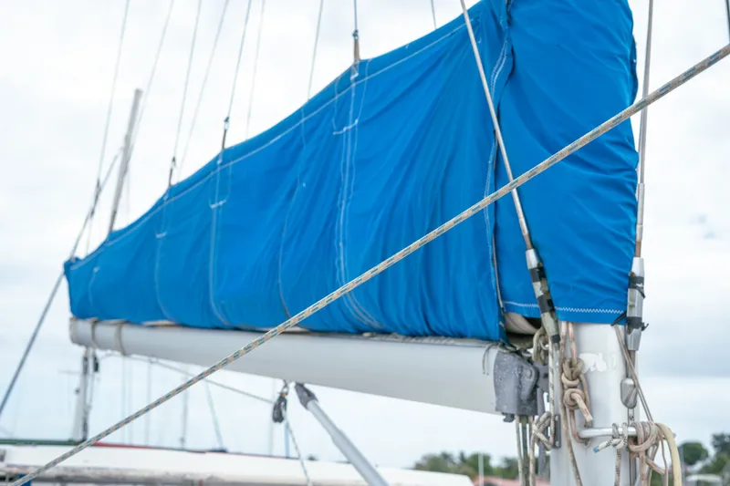 Slide: The Image of Sailboat with blue sail cover, Leopard 38 model, 2011. - 79