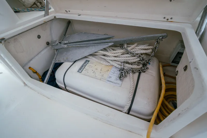 Slide: The Image of Storage compartment on 2011 Leopard 38 yacht with anchor, rope, and rescue equipment. - 162