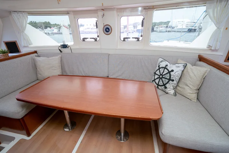Slide: The Image of Interior of 2011 Leopard 38 catamaran with cozy seating and nautical-themed decor. - 138