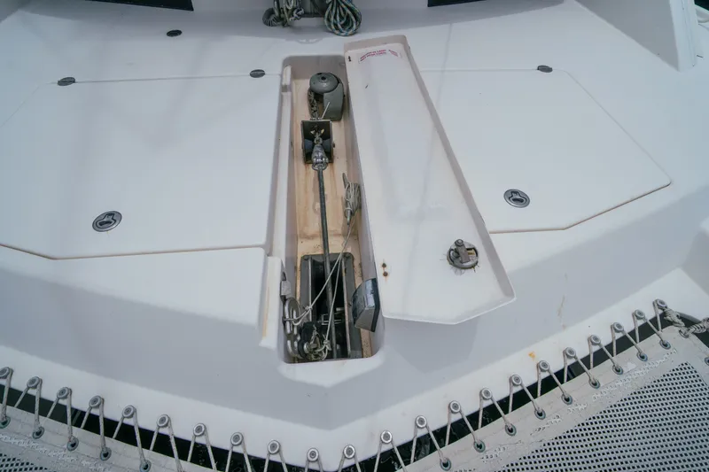 Slide: The Image of Leopard 38 catamaran deck detail, showcasing anchor storage and rigging components, 2011 model. - 164