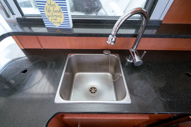 Slide: The Image of Modern kitchen sink with chrome faucet in 2011 Leopard 38 yacht. - 134
