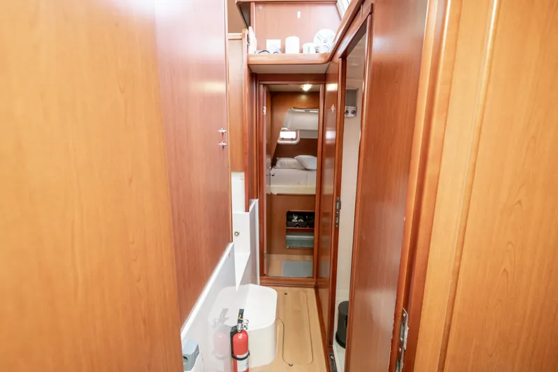 Slide: The Image of Interior of 2011 Leopard 38 yacht with wooden paneling and compact cabin space. - 96
