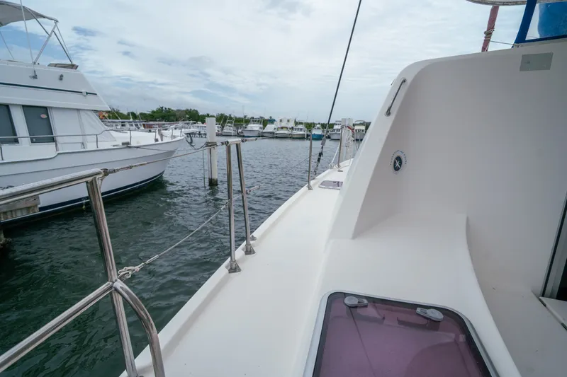 Slide: The Image of 2011 Leopard 38 yacht docked at marina, surrounded by other boats. - 81