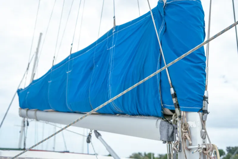 Slide: The Image of Blue sail cover on a 2011 Leopard 38 catamaran, showcasing rigging details. - 78