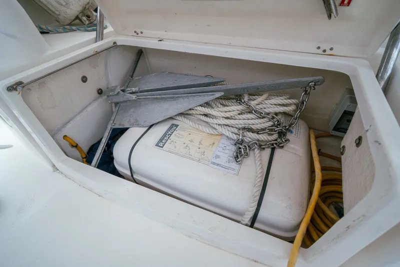 Slide: The Image of Storage compartment on a 2011 Leopard 38 yacht with anchor, rope, and equipment. - 160