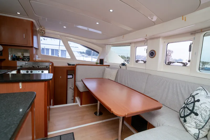 Slide: The Image of Interior of a 2011 Leopard 38 catamaran with cozy seating and modern kitchen. - 112