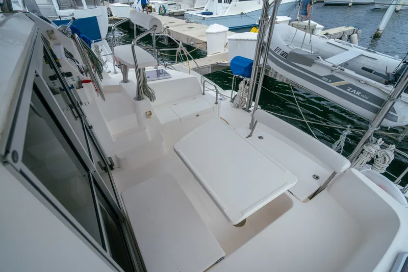 Slide: The Image of Leopard 38 catamaran deck, 2011 model, docked with visible seating and equipment. - 57