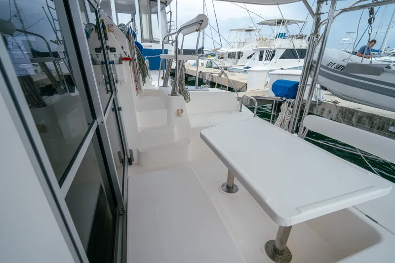 Slide: The Image of Leopard 38 catamaran deck with seating area, docked at marina, 2011 model. - 58