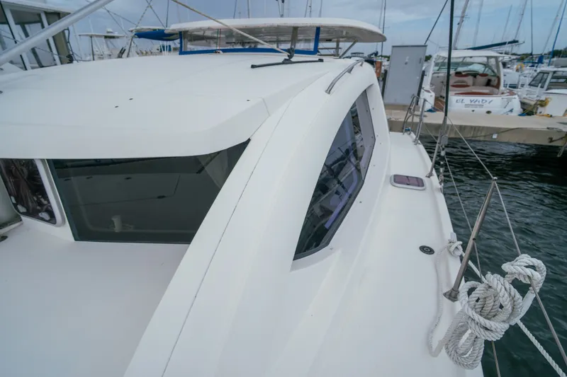 Slide: The Image of Leopard 38 catamaran, 2011 model, docked at marina with visible deck and windows. - 47