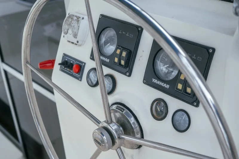 Slide: The Image of Steering wheel and control panel of 2011 Leopard 38 yacht with Yanmar gauges. - 76