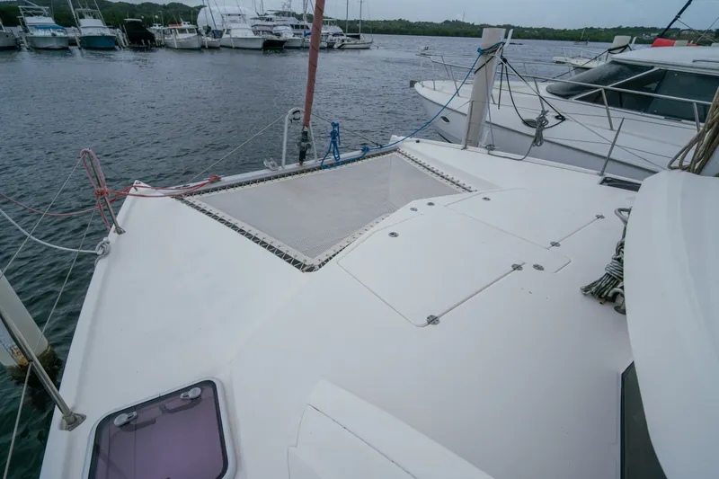 Slide: The Image of 2011 Leopard 38 catamaran deck view at marina with surrounding boats. - 34