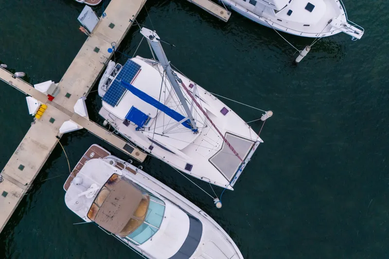 Slide: The Image of Aerial view of a 2011 Leopard 38 catamaran docked at a marina. - 5