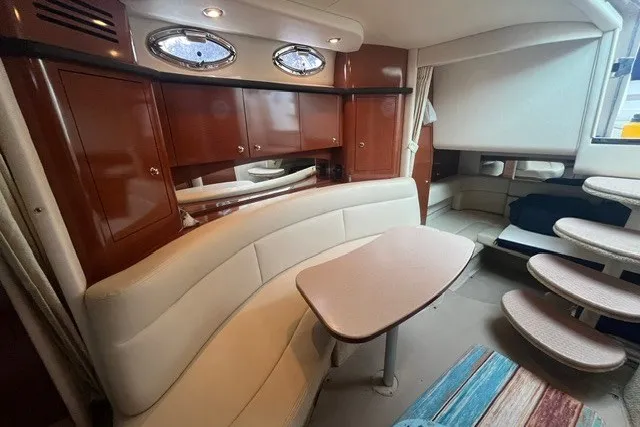 Slide: The Image of Luxurious interior of a 2004 Sea Ray Sundancer 320 yacht with elegant seating and cabinetry. - 20