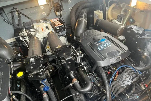 Slide: The Image of Engine compartment of a 2004 Sea Ray Sundancer 320 boat, showcasing mechanical components. - 33