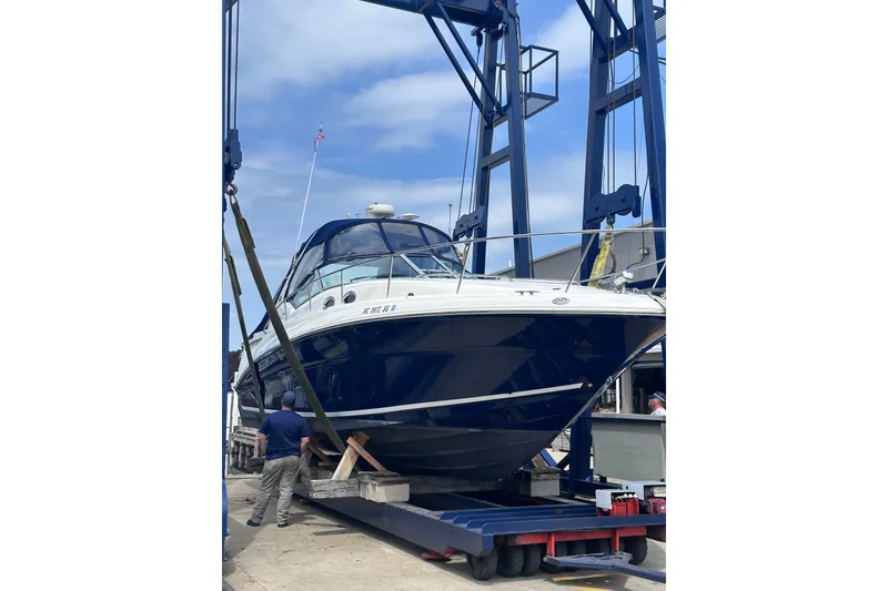 Slide: The Image of 2004 Sea Ray Sundancer 320 yacht on a lift at a marina. - 4