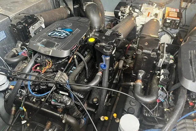 Slide: The Image of Engine compartment of a 2004 Sea Ray Sundancer 320 boat, showcasing dual engines. - 32