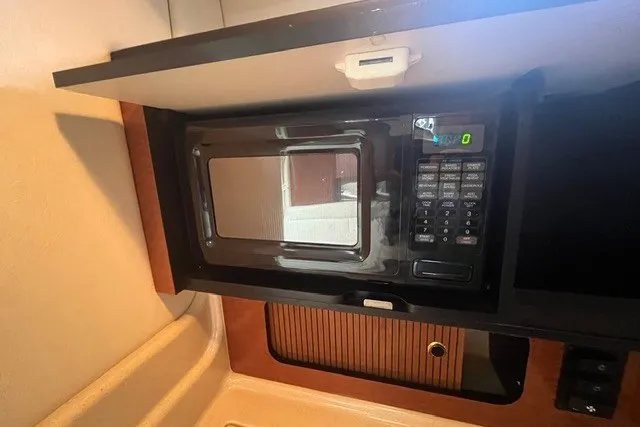 Slide: The Image of Microwave in 2004 Sea Ray Sundancer 320 yacht interior kitchen area. - 25