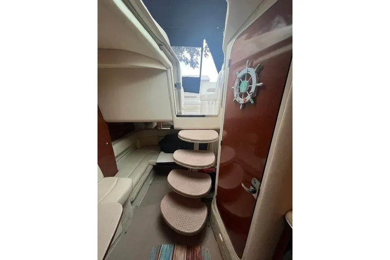Slide: The Image of Interior view of 2004 Sea Ray Sundancer 320 yacht with curved steps and seating area. - 28