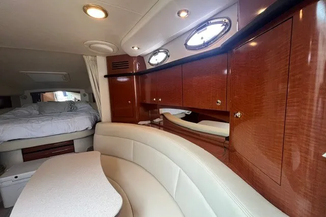 Slide: The Image of Luxurious interior of a 2004 Sea Ray Sundancer 320 yacht with elegant wood cabinetry. - 19