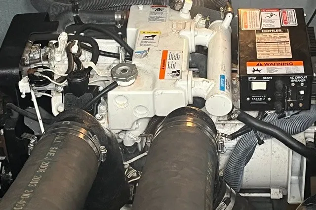 Slide: The Image of Engine compartment of a 2004 Sea Ray Sundancer 320 with visible Kohler generator. - 34