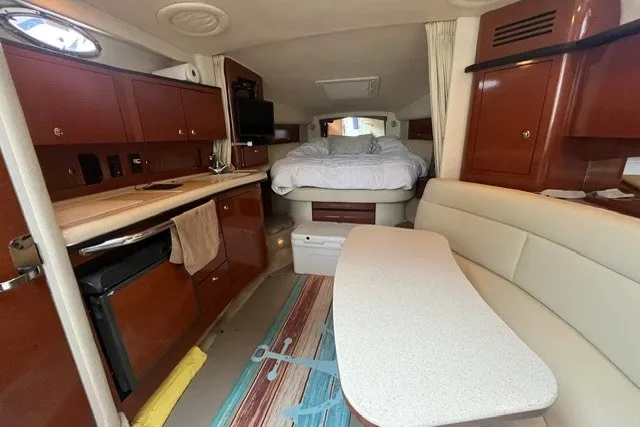 Slide: The Image of Interior of 2004 Sea Ray Sundancer 320 yacht with cozy cabin and kitchenette. - 17