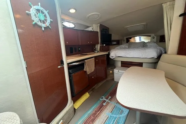 Slide: The Image of Interior of 2004 Sea Ray Sundancer 320 yacht with cozy cabin and kitchenette. - 18