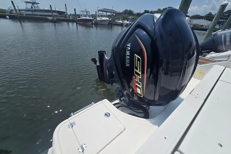 Slide: The Image of 2022 Robalo R230 Center Console with Yamaha outboard engine at marina. - 15