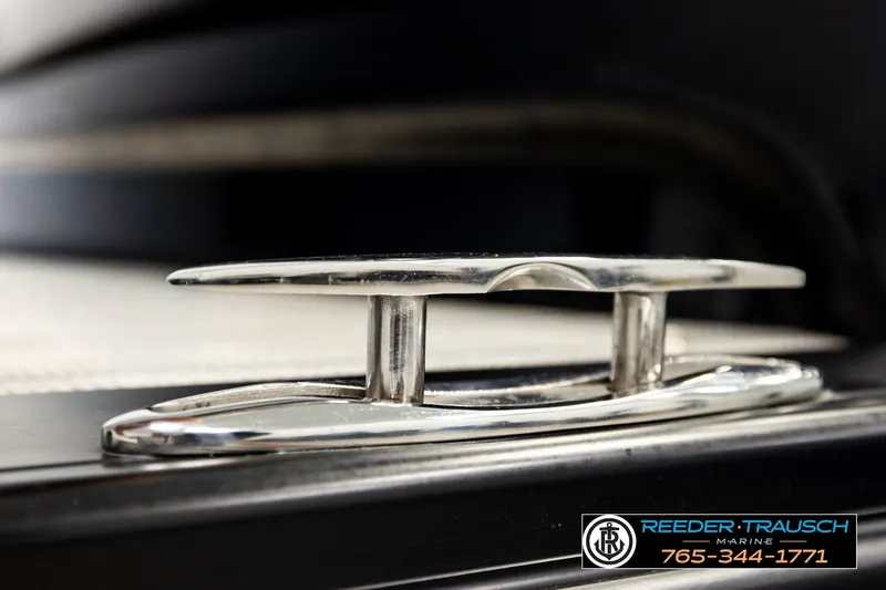 Slide: The Image of Close-up of a 2021 Avalon EXCALIBUR boat cleat, featuring sleek chrome finish. - 61