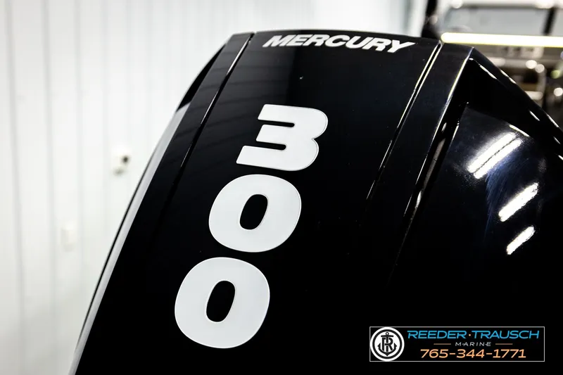 Slide: The Image of Mercury 300 outboard engine on 2021 Avalon EXCALIBUR boat, Reeder-Trausch Marine branding. - 54