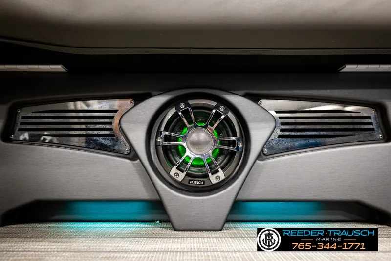 Slide: The Image of Speaker system in 2021 Avalon EXCALIBUR boat, featuring green LED lighting. - 44