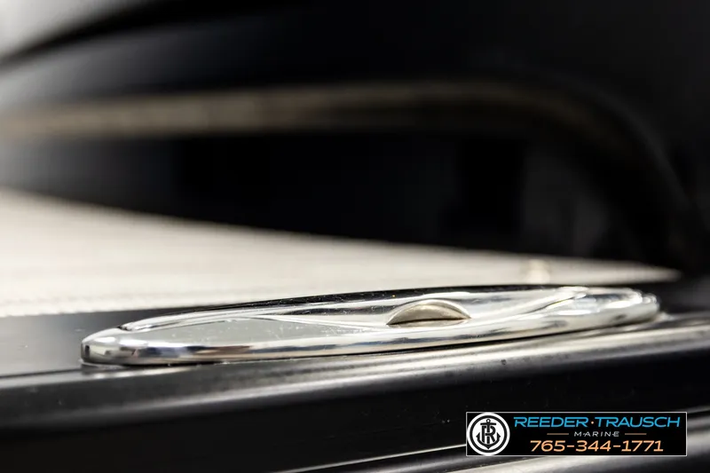 Slide: The Image of Close-up of 2021 Avalon EXCALIBUR boat detail with Reeder Trausch Marine contact information. - 60