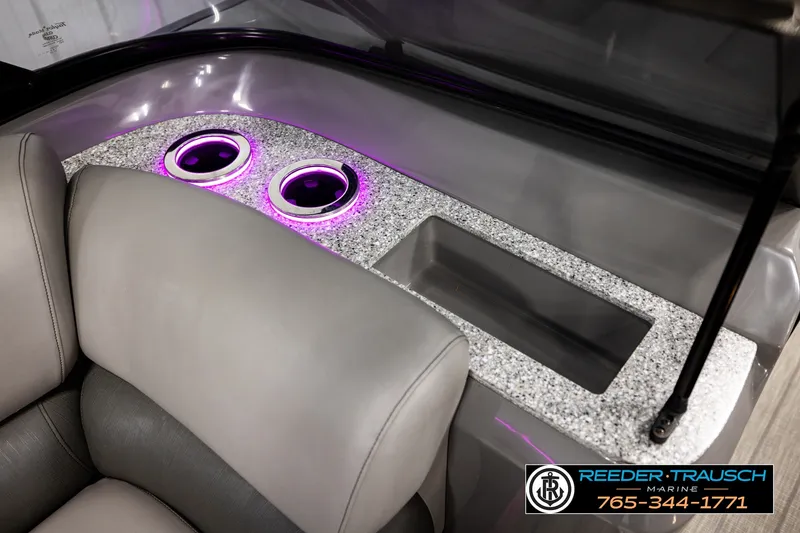 Slide: The Image of Luxurious 2021 Avalon EXCALIBUR boat interior with illuminated cup holders and plush seating. - 39
