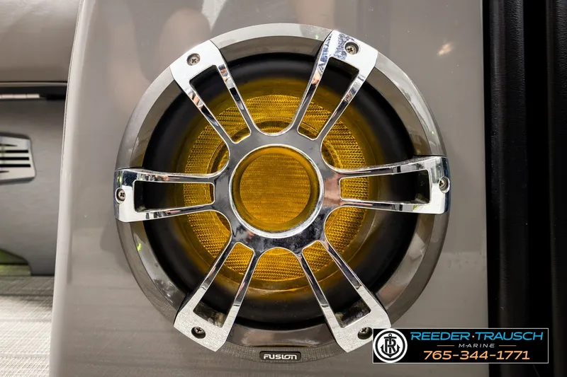Slide: The Image of Chrome and yellow speaker on 2021 Avalon EXCALIBUR boat, featuring Fusion audio system. - 43