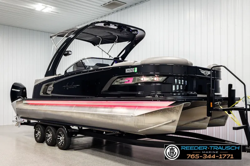 Slide: The Image of 2021 Avalon EXCALIBUR pontoon boat on trailer in indoor showroom. - 3