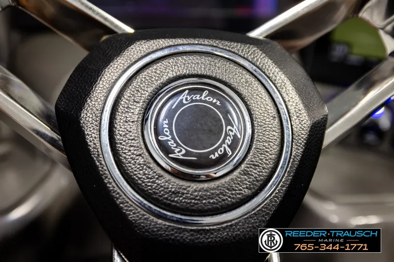 Slide: The Image of 2021 Avalon EXCALIBUR steering wheel with logo, featuring Reeder Trausch Marine contact details. - 32