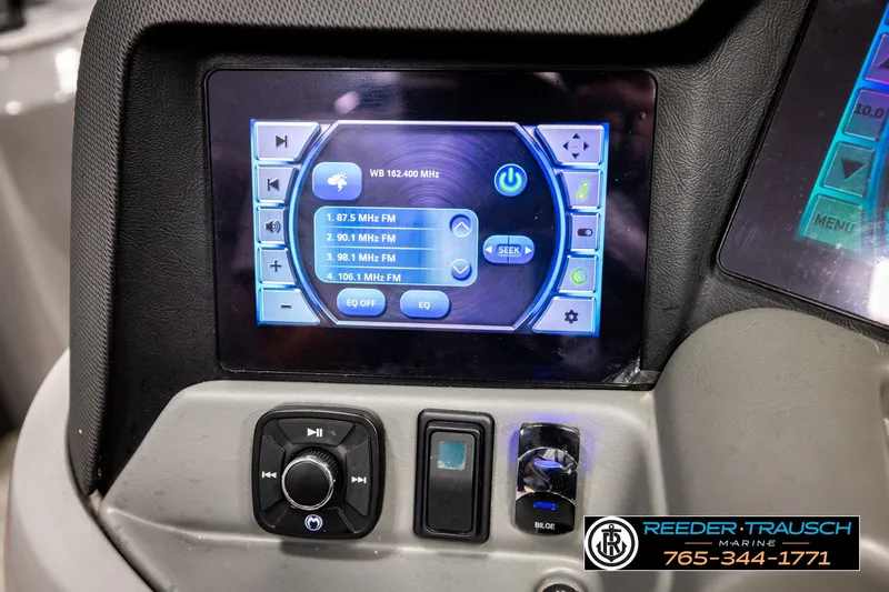 Slide: The Image of Control panel of 2021 Avalon EXCALIBUR boat with touchscreen radio interface. - 34